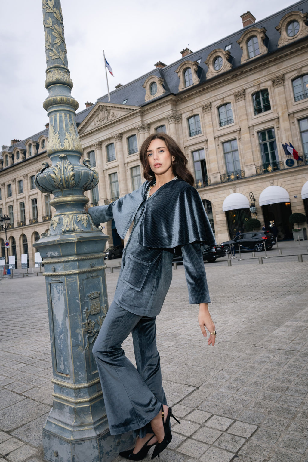 Woman in a velvet silver grey suit dancing. Party outfit. Ramadan outfit.